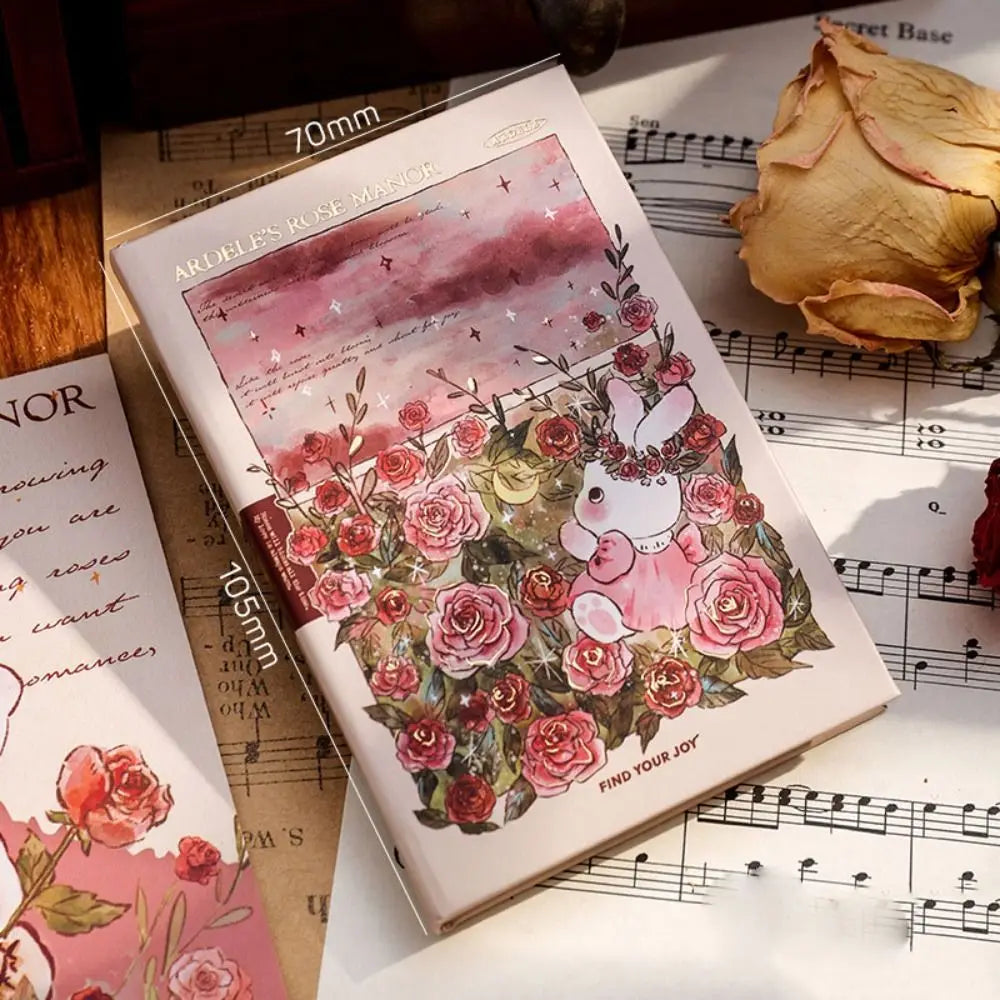 Card with floral design and rabbit illustration on a sheet of music
