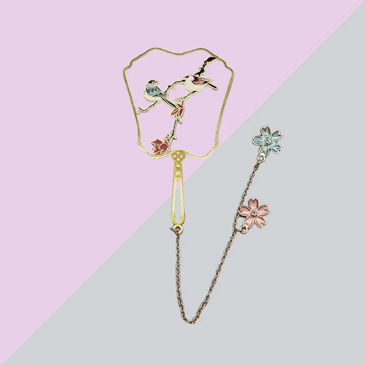 birds with two flowers dangling from a chain