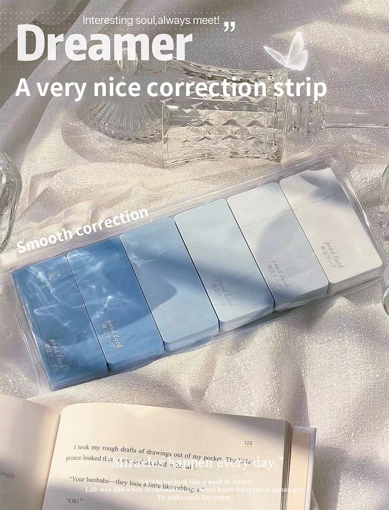 Blue correction strips in packaging on a textured surface with text overlay.