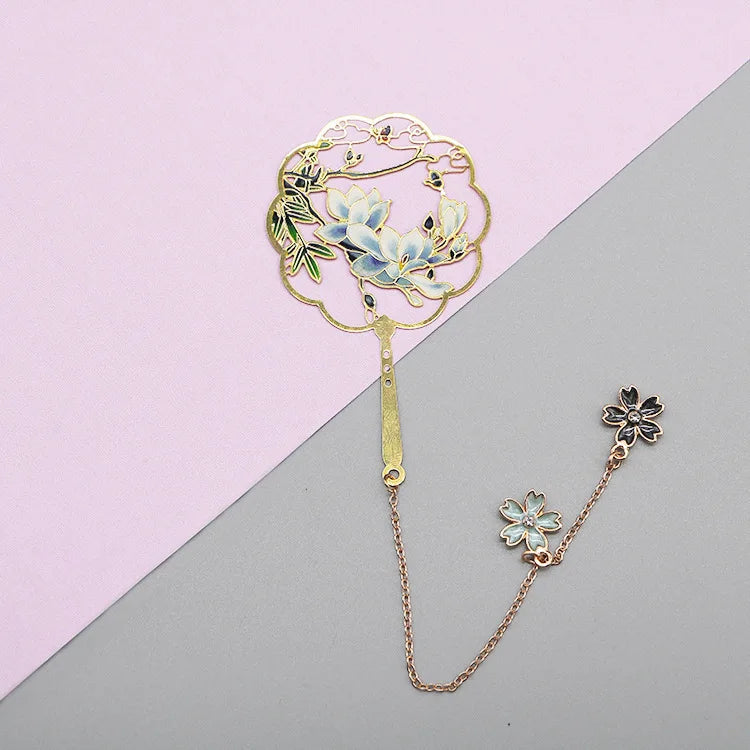 blue flowers with two flowers dangling on a chain