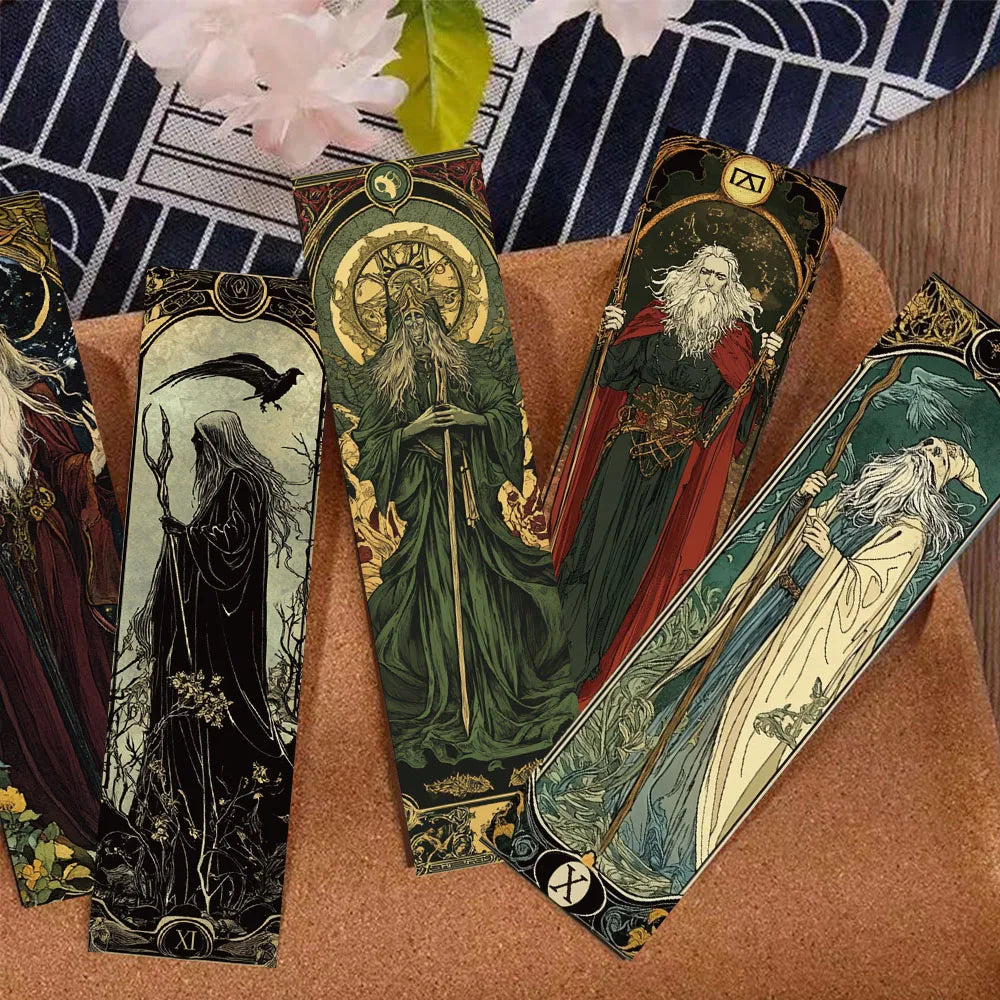Set of tarot cards with detailed illustrations on a brown surface.