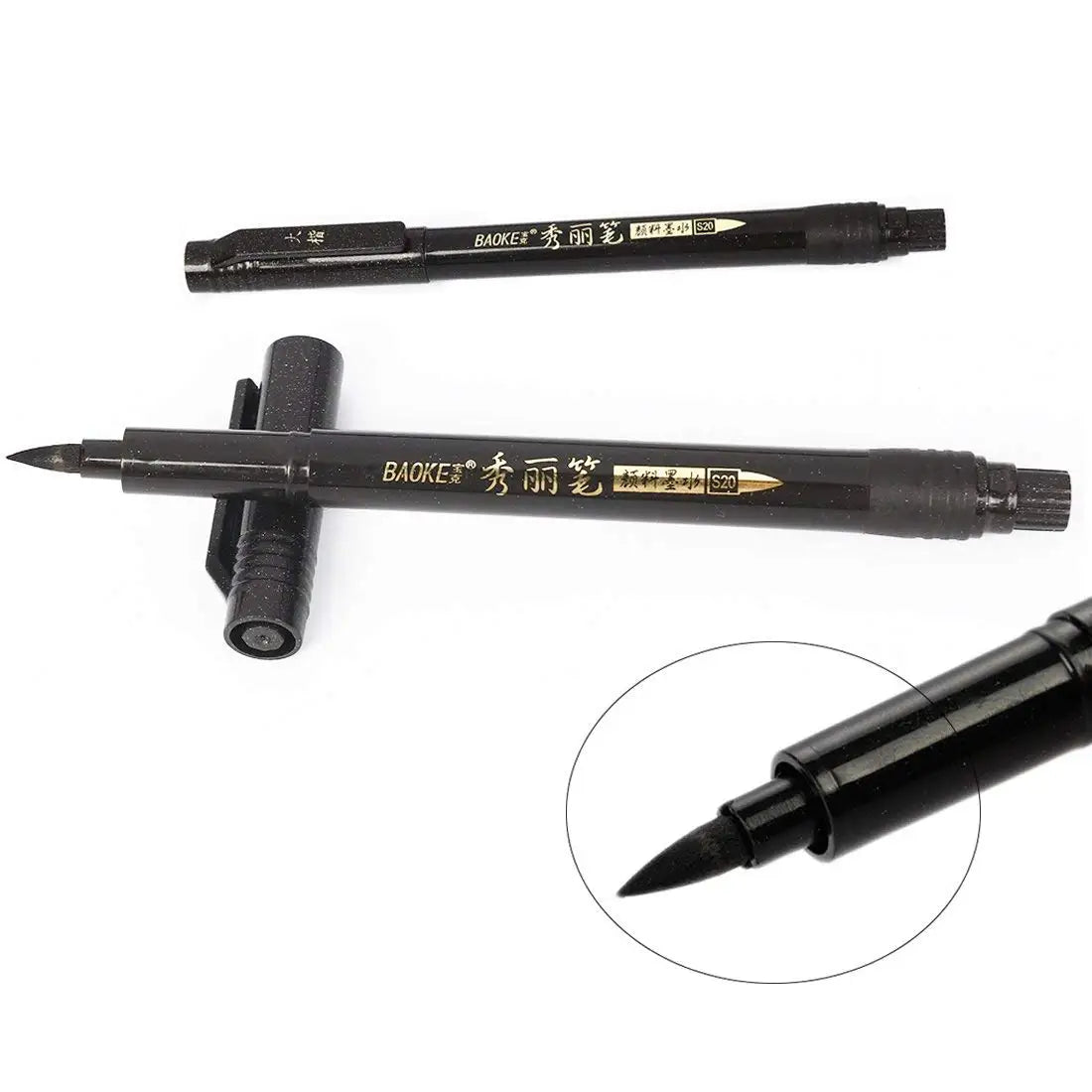 Two black markers with visible branding on a white background