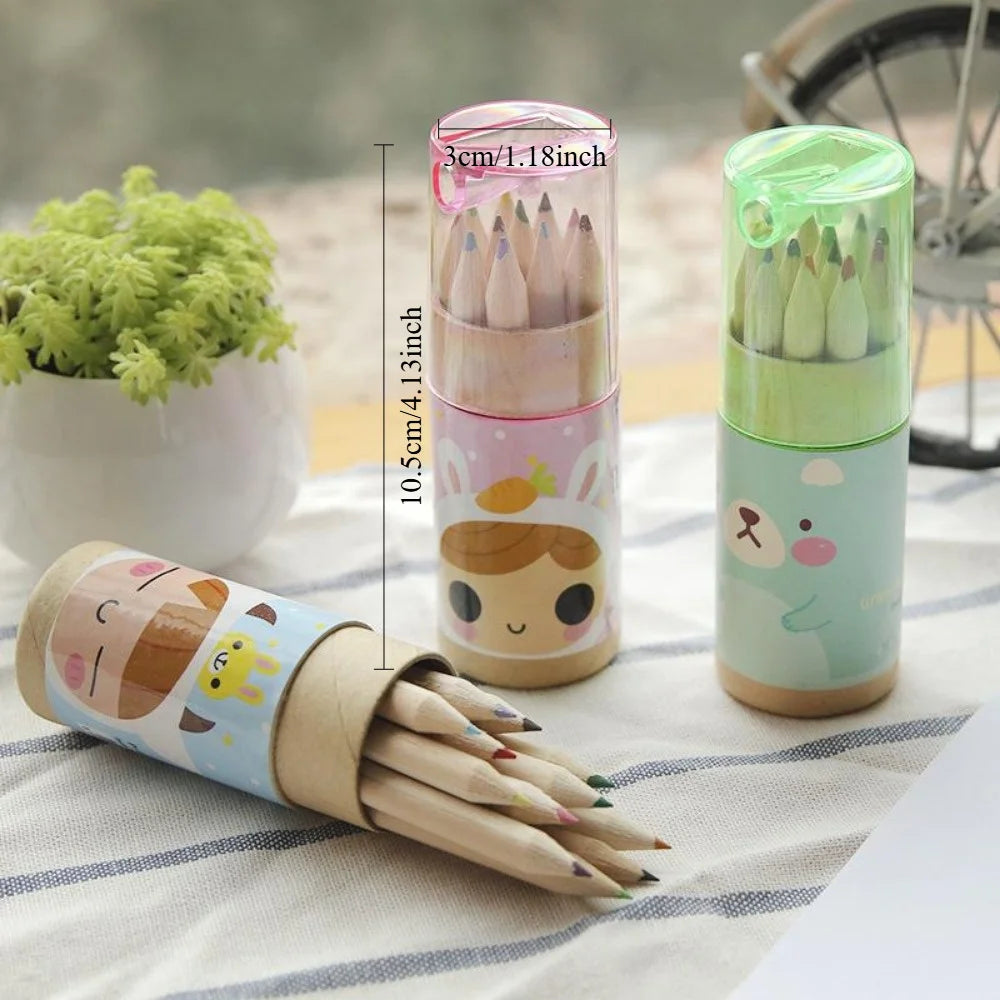 Set of colored pencils in cartoon-themed cases on a table with a plant in the background.