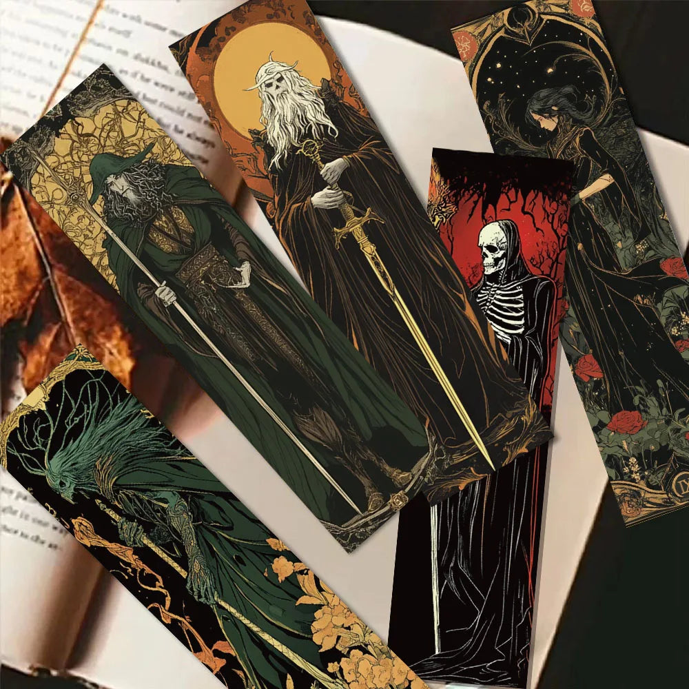 Gothic-style tarot cards with dark, ornate designs on a white surface.