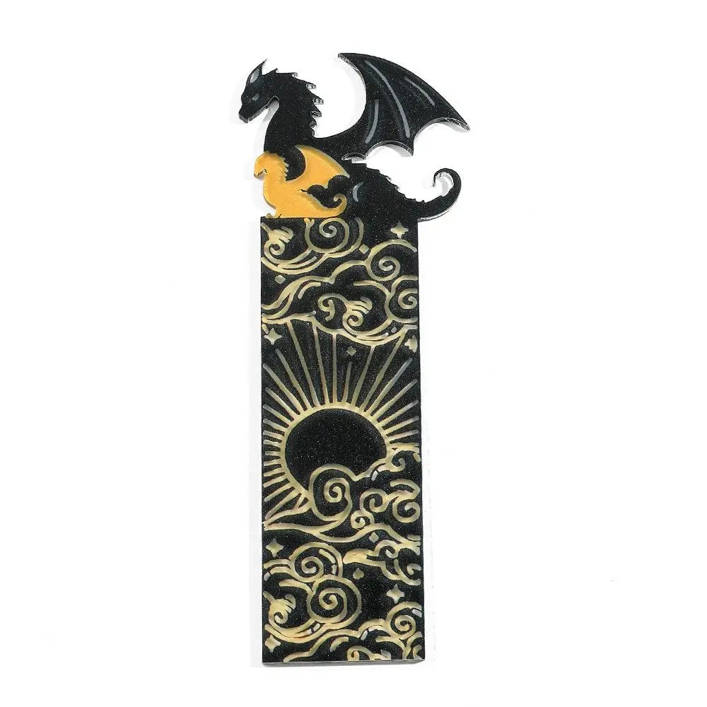 Decorative bookmark with a black dragon design on a white background
