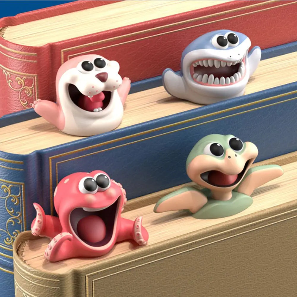 Four colorful animal figurines on a stack of books with a blue and red book in the background.