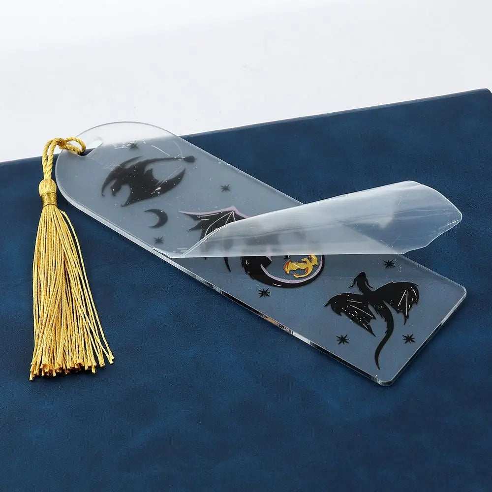 Decorative bookmark with tassel on a blue surface