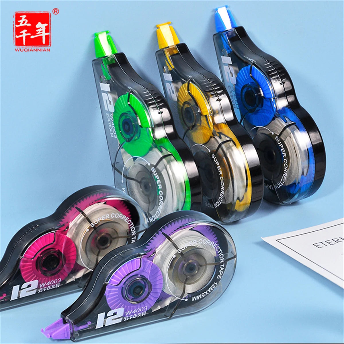Set of correction tapes with colorful accents on a light blue background
