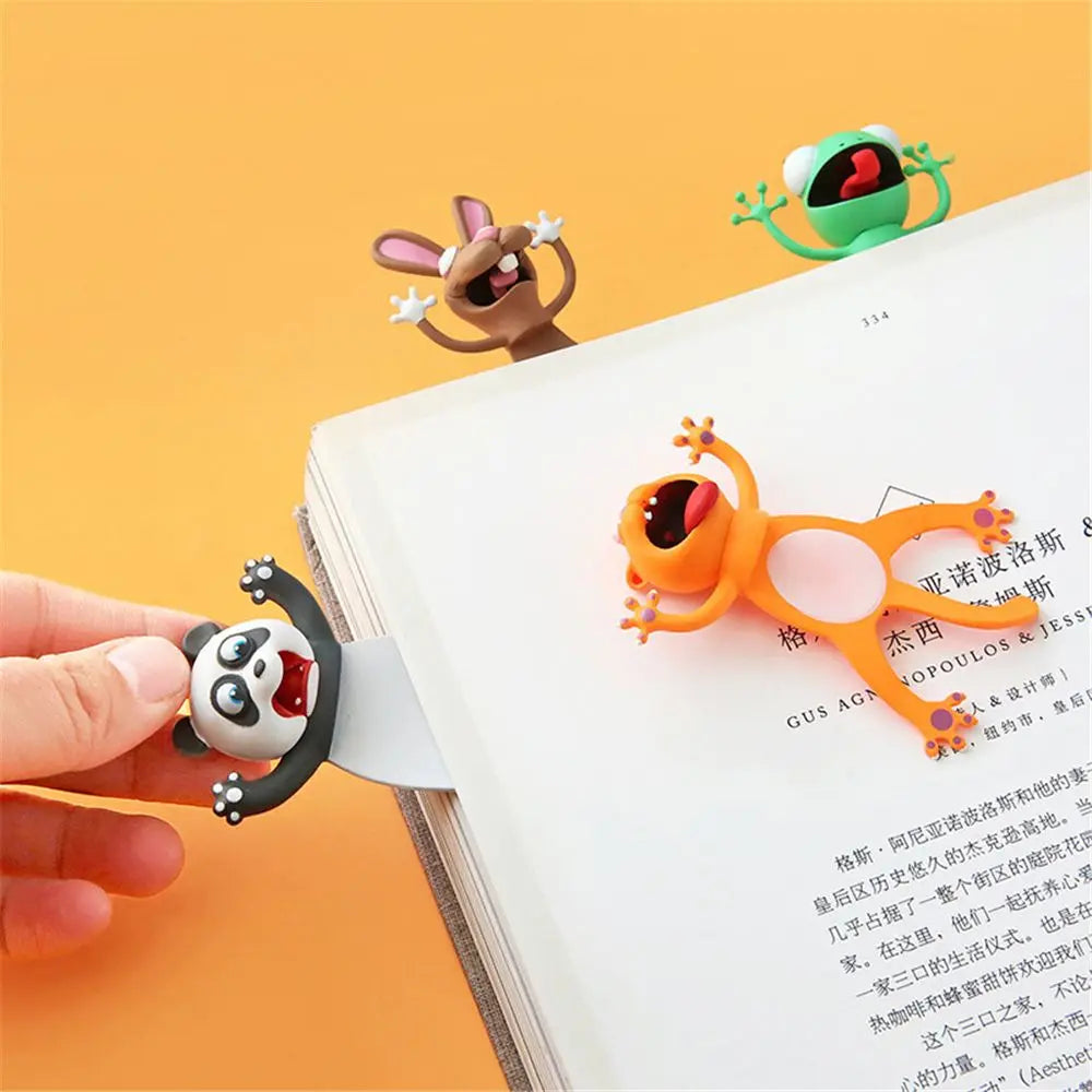 Colorful animal-shaped bookmarks on an open book with a yellow background