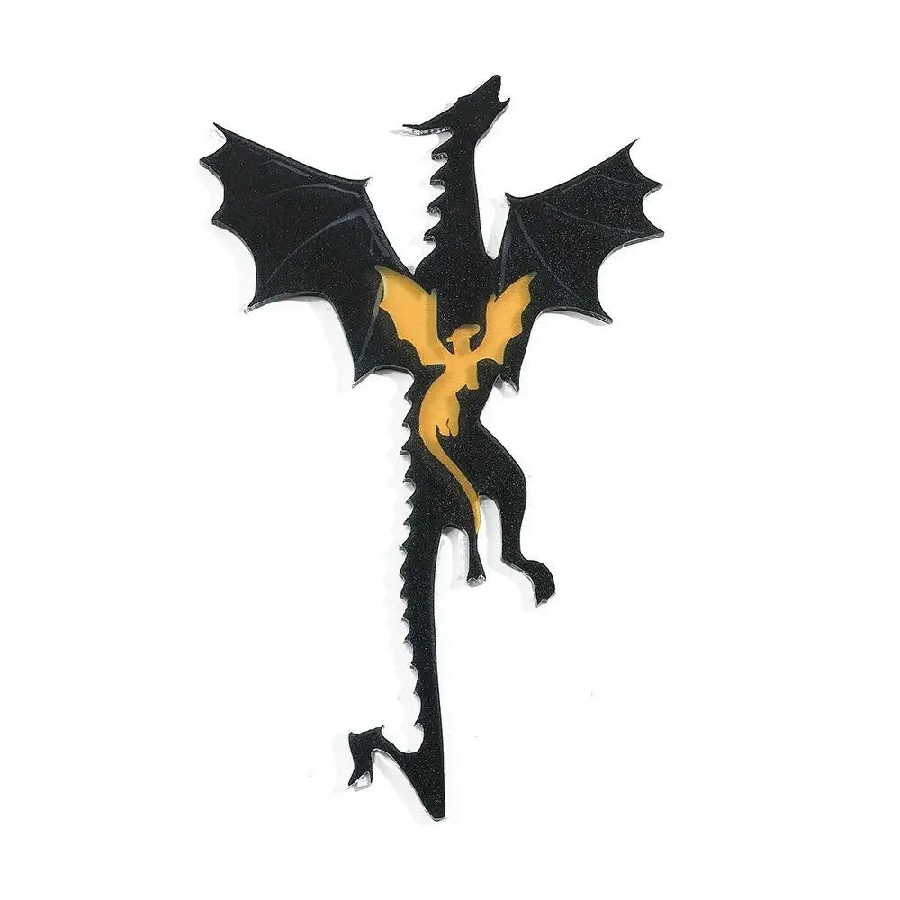Black and gold dragon-shaped keychain on a white background