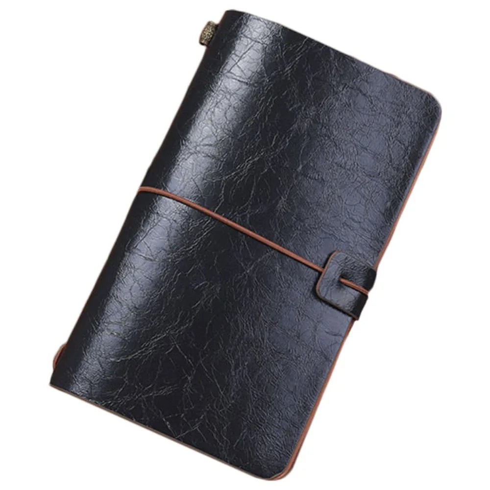 Black leather notebook with a strap closure on a white background