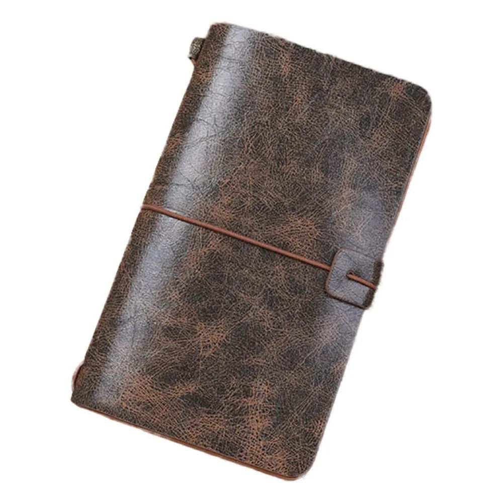 Brown leather notebook with strap closure on a white background