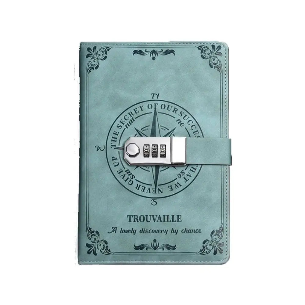 Teal notebook with a compass design and 'Trouvaille' branding on a white background