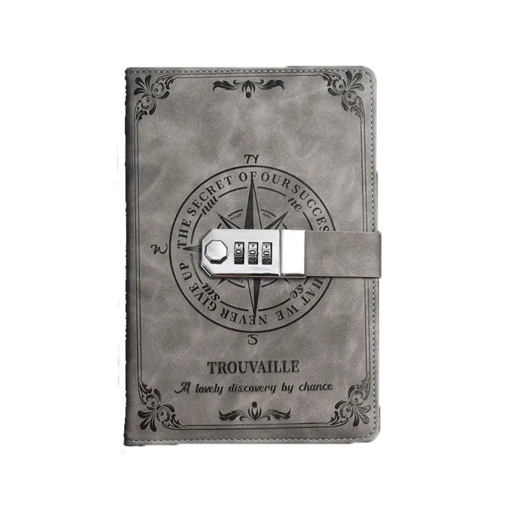 Gray leather notebook with compass design and combination lock on a white background