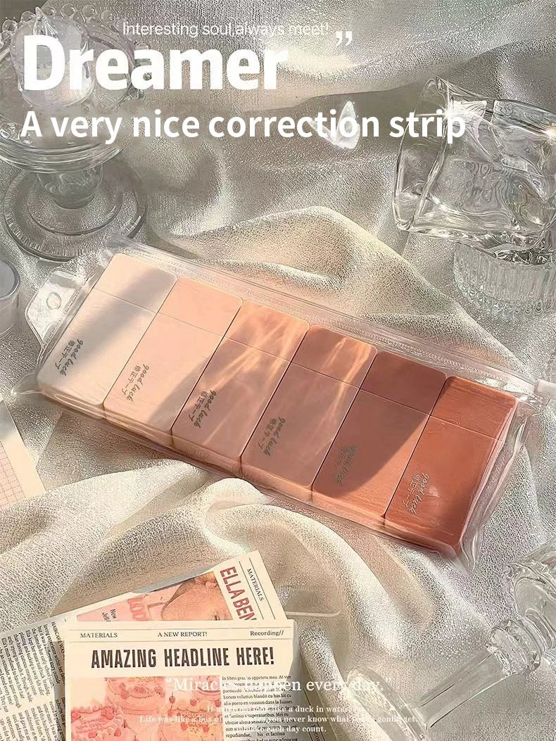 Packaged correction strip with decorative elements on a light fabric background