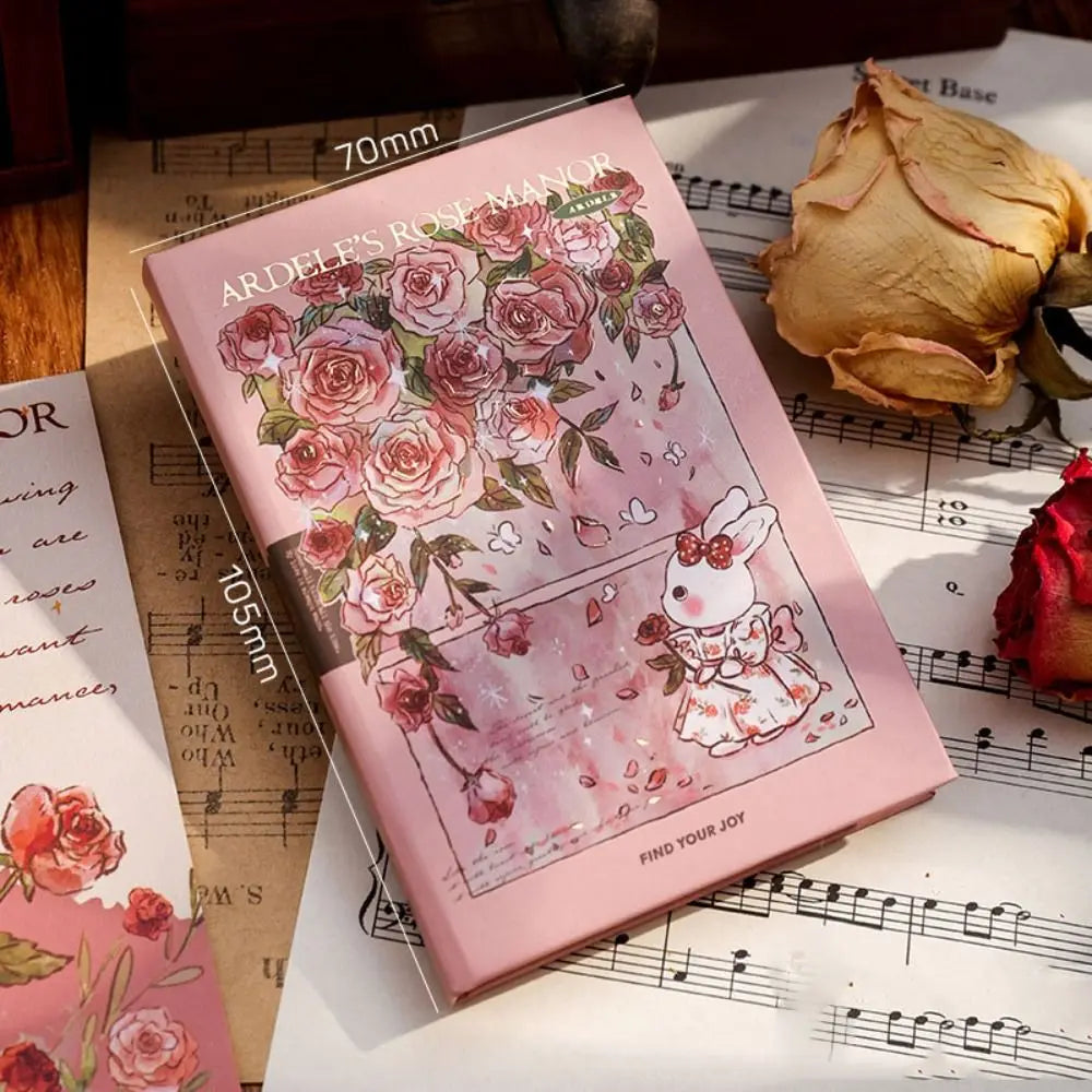 Pink phone case with floral design and cartoon character on a sheet of music