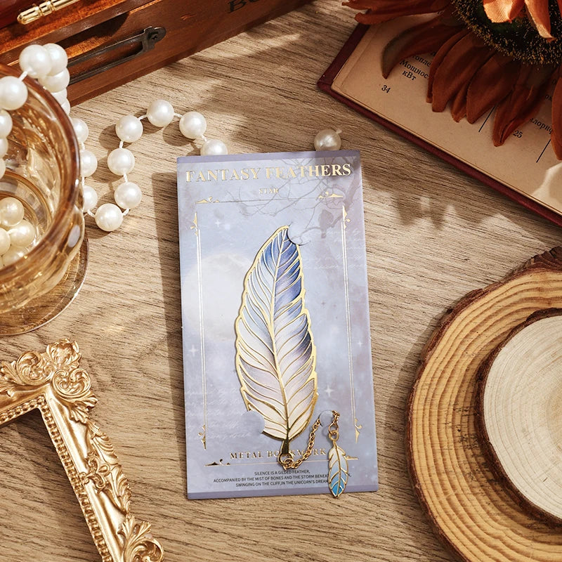 Fantasy Feather earrings packaging on a wooden surface with decorative items.