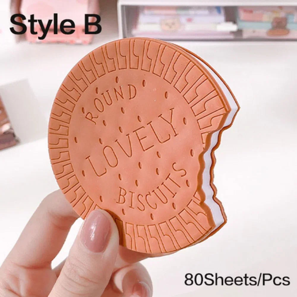 Round Lovely Biscuits-shaped product held by a hand with a blurred background