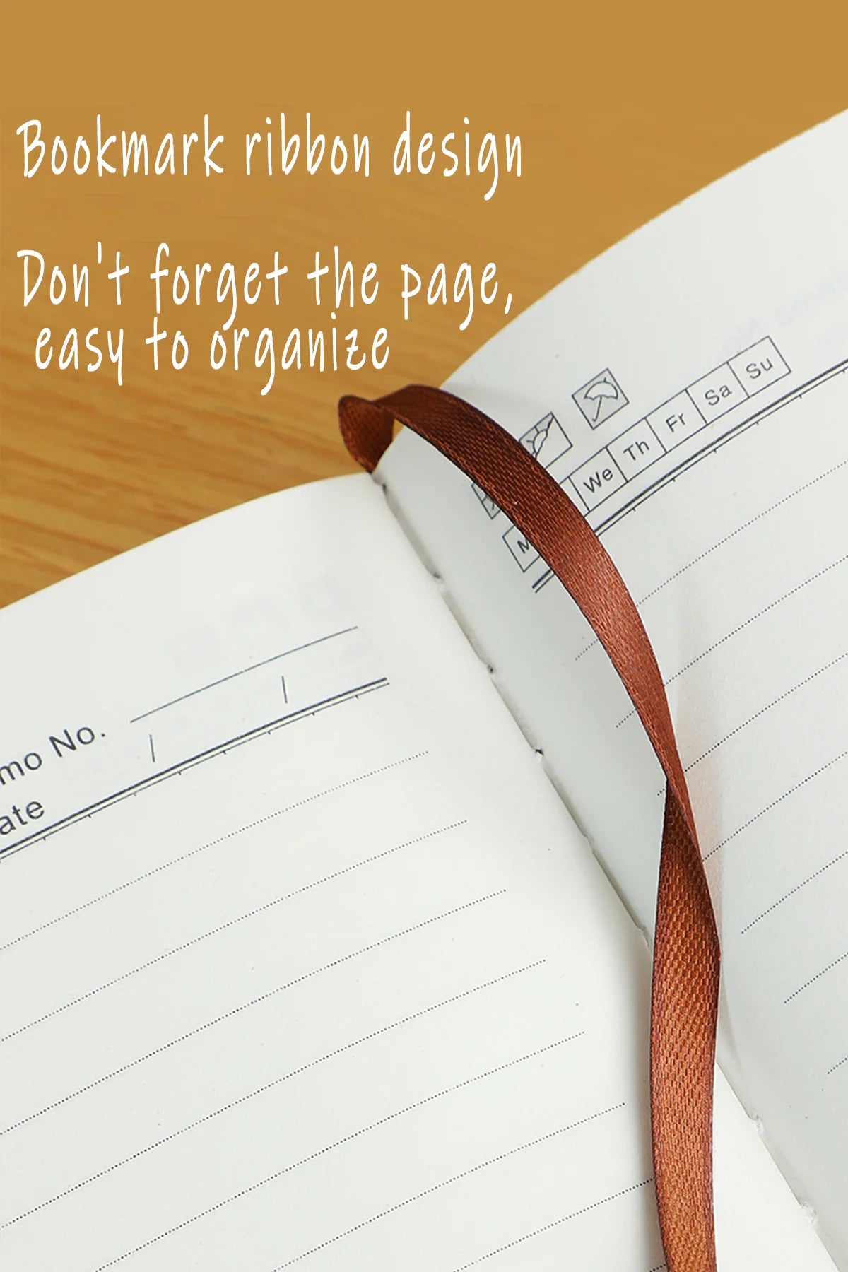 Open notebook with a bookmark ribbon on a wooden surface