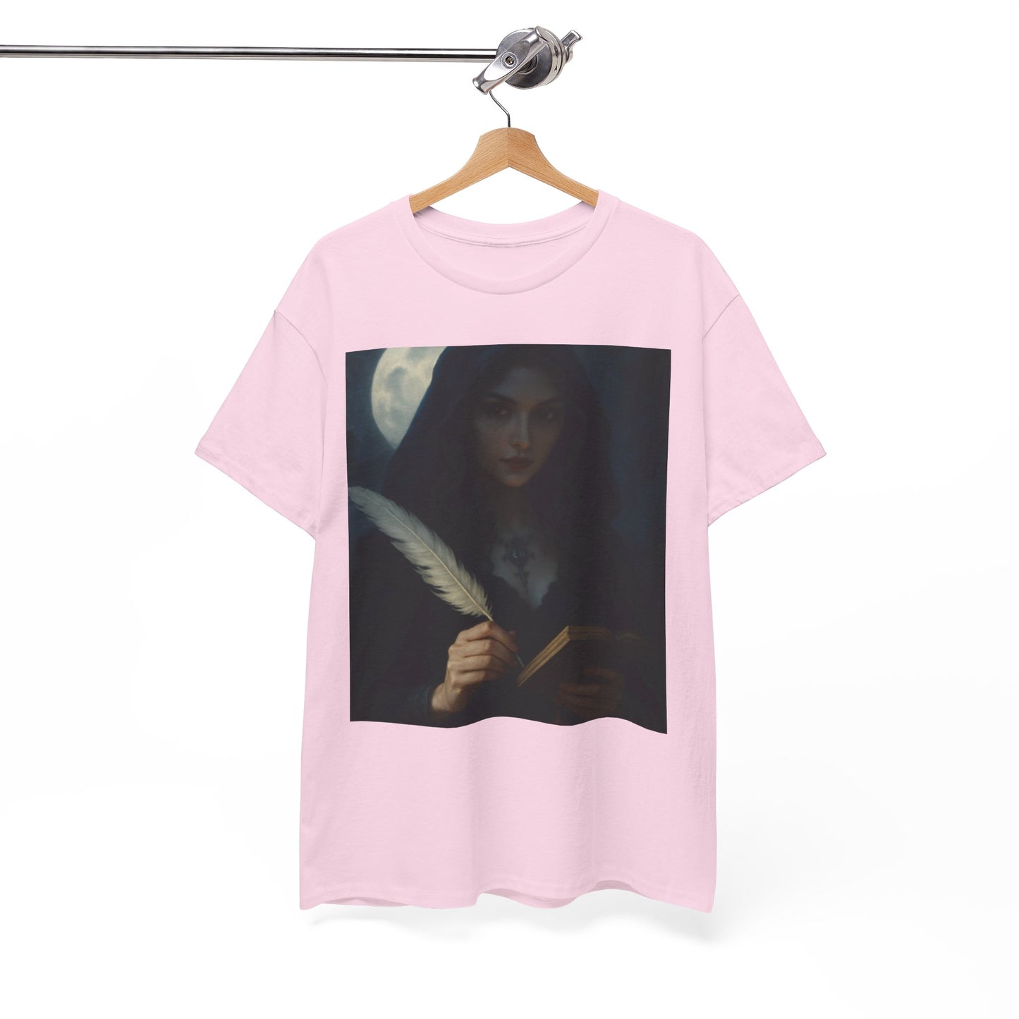 Pink t-shirt with a graphic design of a woman holding a feather quill on a hanger against a white background