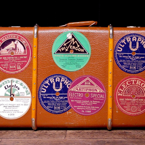 luggage with large round stickers 