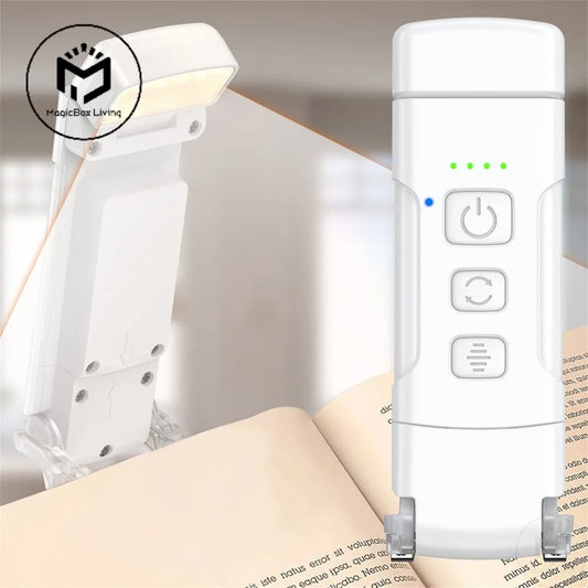 A white book light with timer attached to an open book, demonstrating its clip design and illumination.