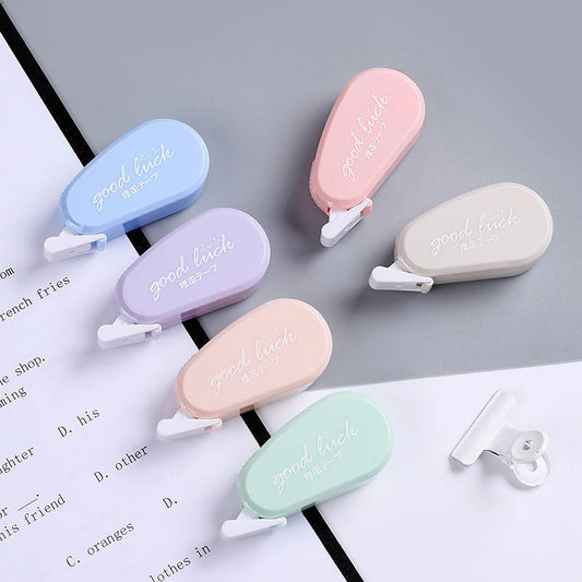Set of colorful clip-on text markers on a book page