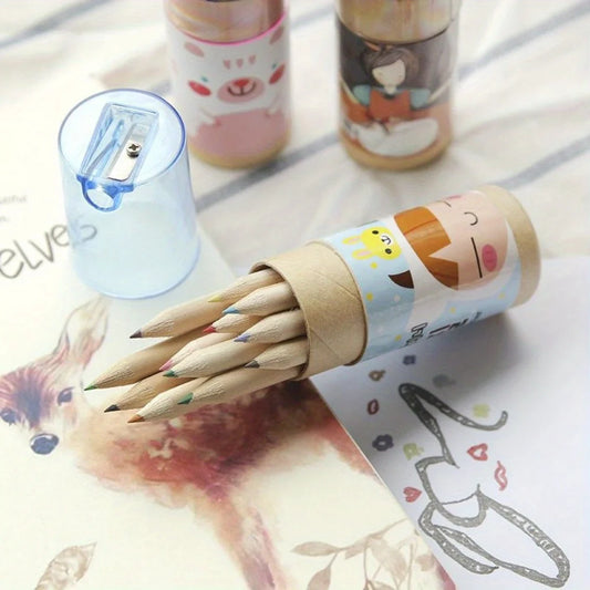 Set of wooden pencils in a decorative cardboard tube with cartoon faces on a table with stationery items.