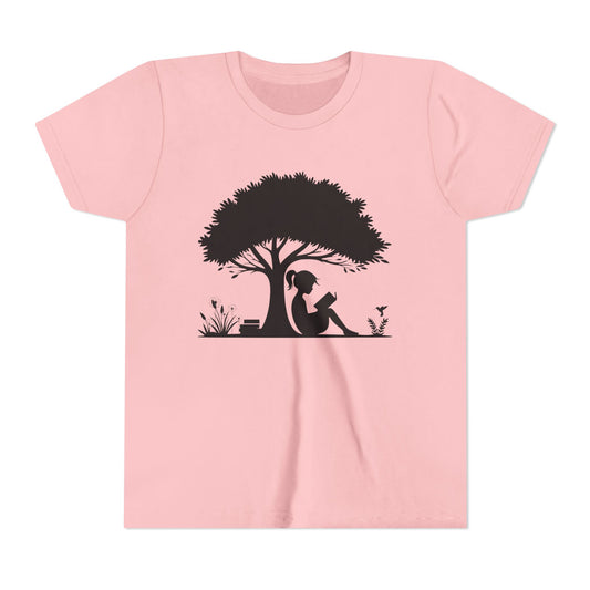 Pink t-shirt with a black silhouette of a girl under a tree on a white background