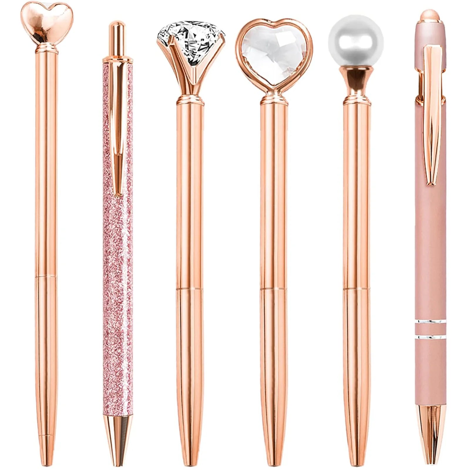 Set of rose gold pens with decorative tips on a white background