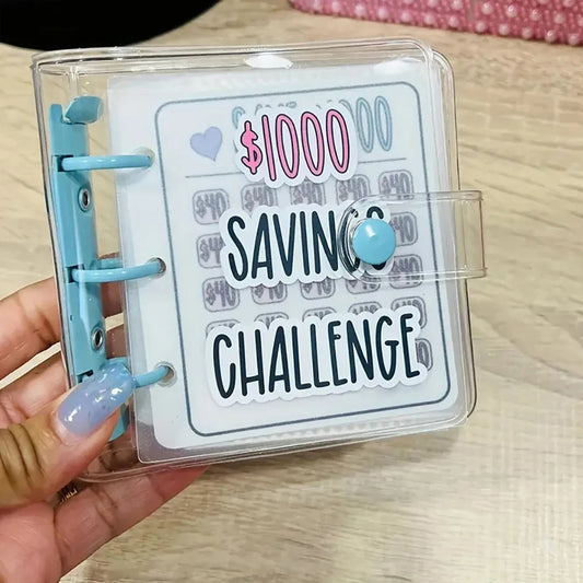 Hand holding a 'Saving Challenge' card with a clear plastic case on a wooden surface.