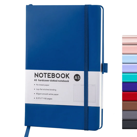 A blue A5 Sketchbook Notebook with a strap closure, displayed alongside a selection of its color variants.