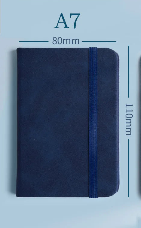 Small notebook with dimensions and text on a light blue background