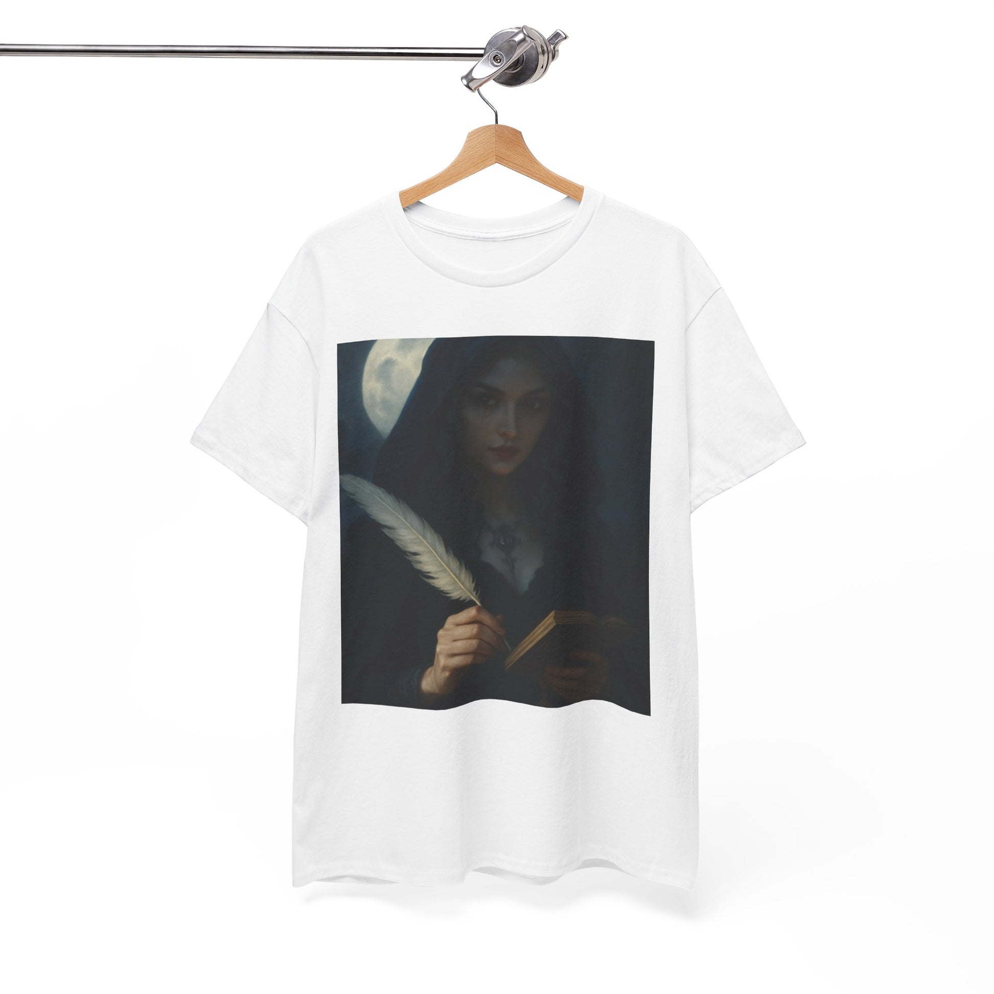 White t-shirt with a graphic design of a woman holding a feather and a book, hanging on a wooden hanger against a white background.