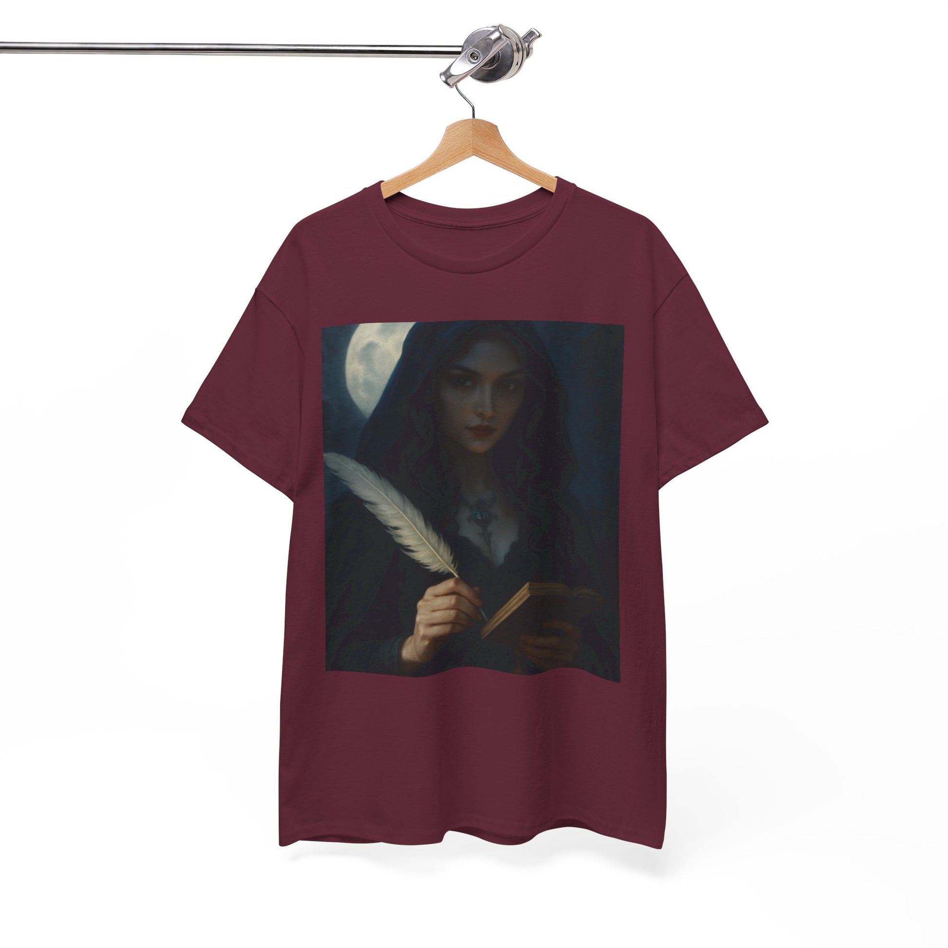 Maroon t-shirt with a graphic of a woman holding a feather pen and book on a hanger against a white background.